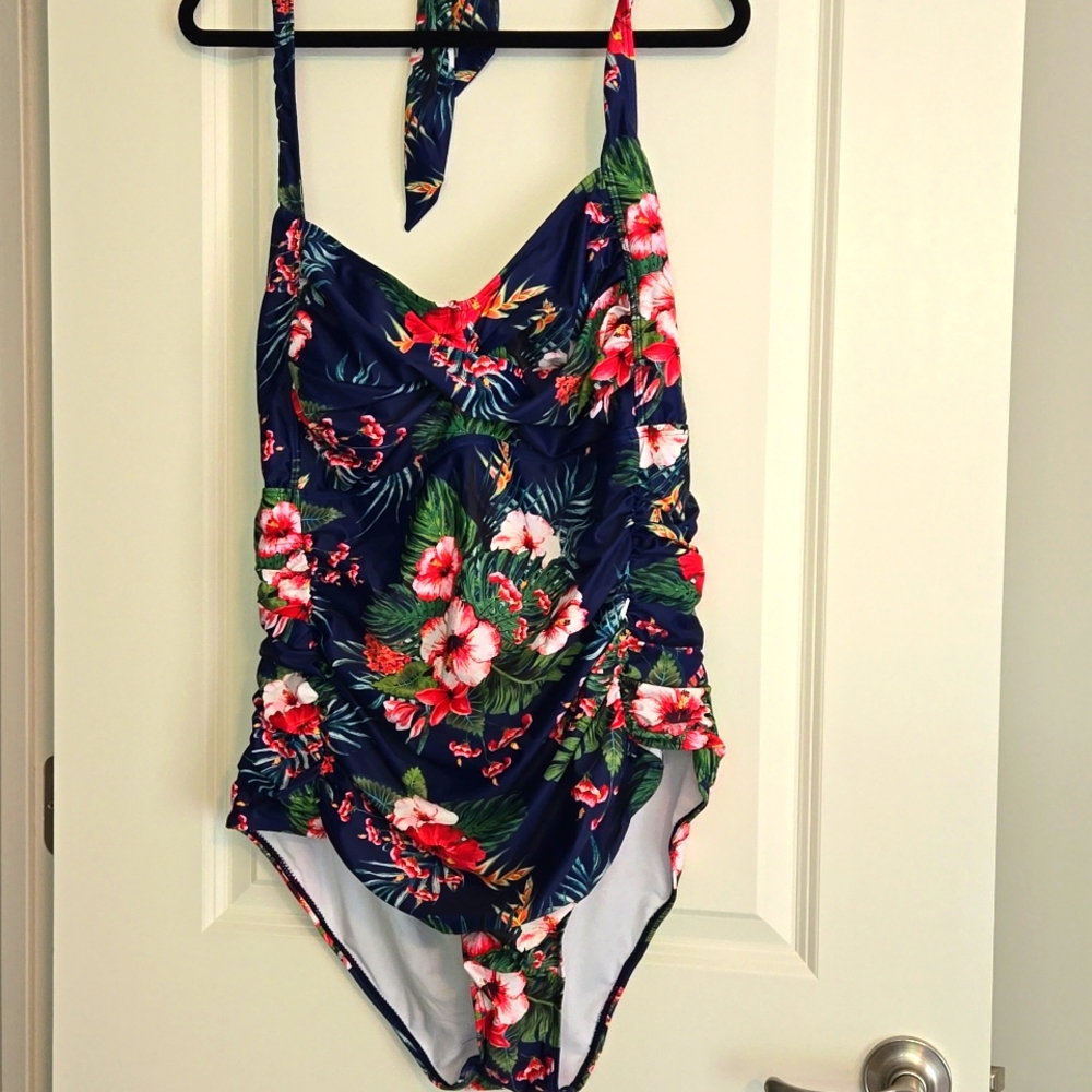 New (hygiene liner intact) halter top style swimsuit.New In Package